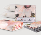 Set matrimoniale FLORA con completo letto panna o grigio, trapuntino floreale da 250×270 cm e due guanciali ARGANA con olio di Argan.