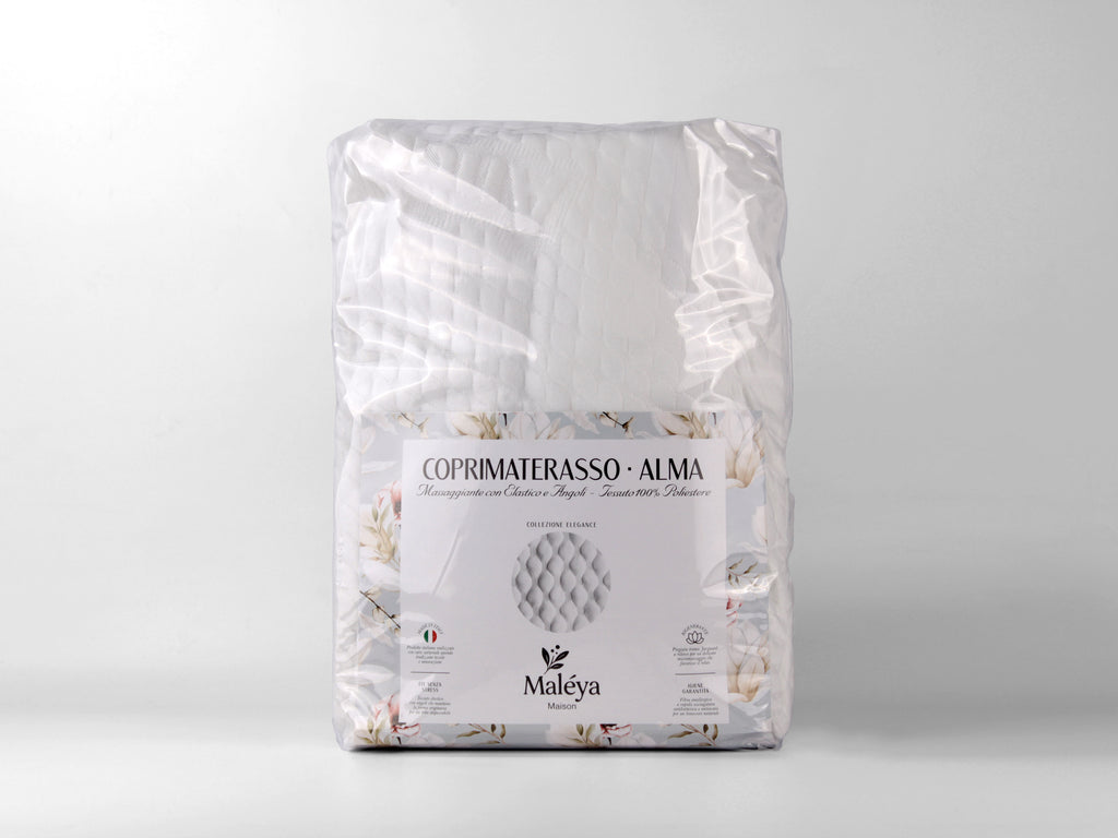 Coprimaterasso ALMA matrimoniale bianco con trapuntatura massaggiante e elastico agli angoli.