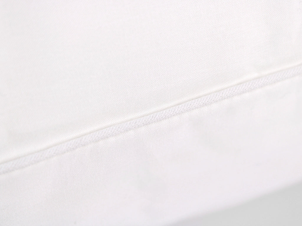 Guanciale PLUMIA bianco extra soffice con imbottitura effetto piuma e federa traspirante in cotone.