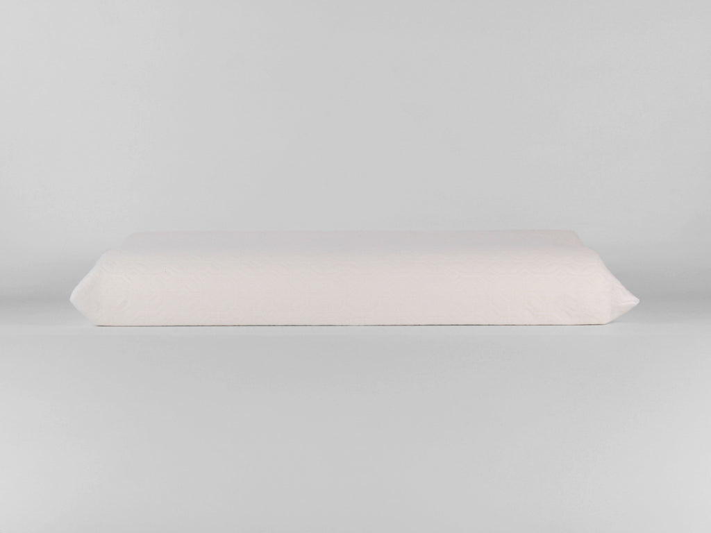 Guanciale NALEA bianco in memory foam cervicale con profilo ergonomico sagomato.