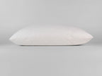 Guanciale PLUMIA bianco extra soffice con imbottitura effetto piuma e federa traspirante in cotone.